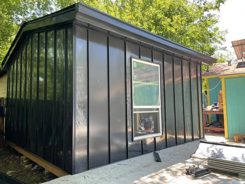 Black standing seam metal wall panels for Roof Inspection in Queen Creek